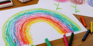Drawing of rainbow with crayons